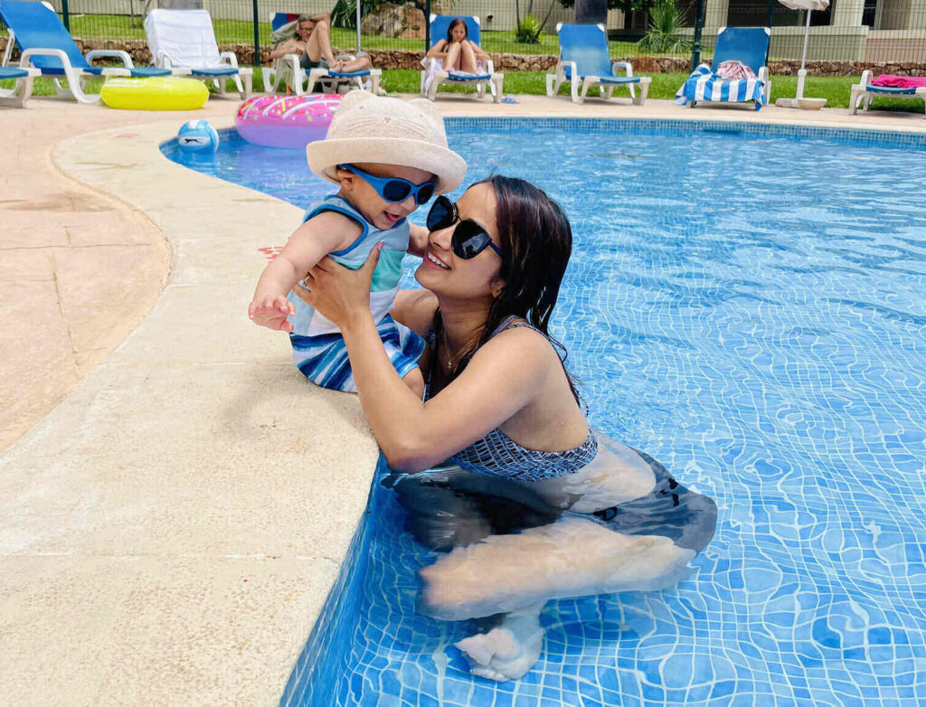 Au Pair with baby at the pool